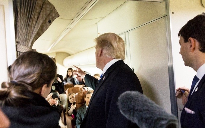 President Donald J. Trump answers reporter’s questions aboard Air Force One, Thursday, April 5, 2018, on the return flight to Washington, D.C., following President Trump’s participation in a roundtable discussion on the benefits of tax reform.