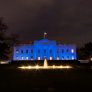 Blue light illuminates the North Portico of the White House, Monday evening, April 2, 2018, in recognition of World Autism Awareness Day 2018.